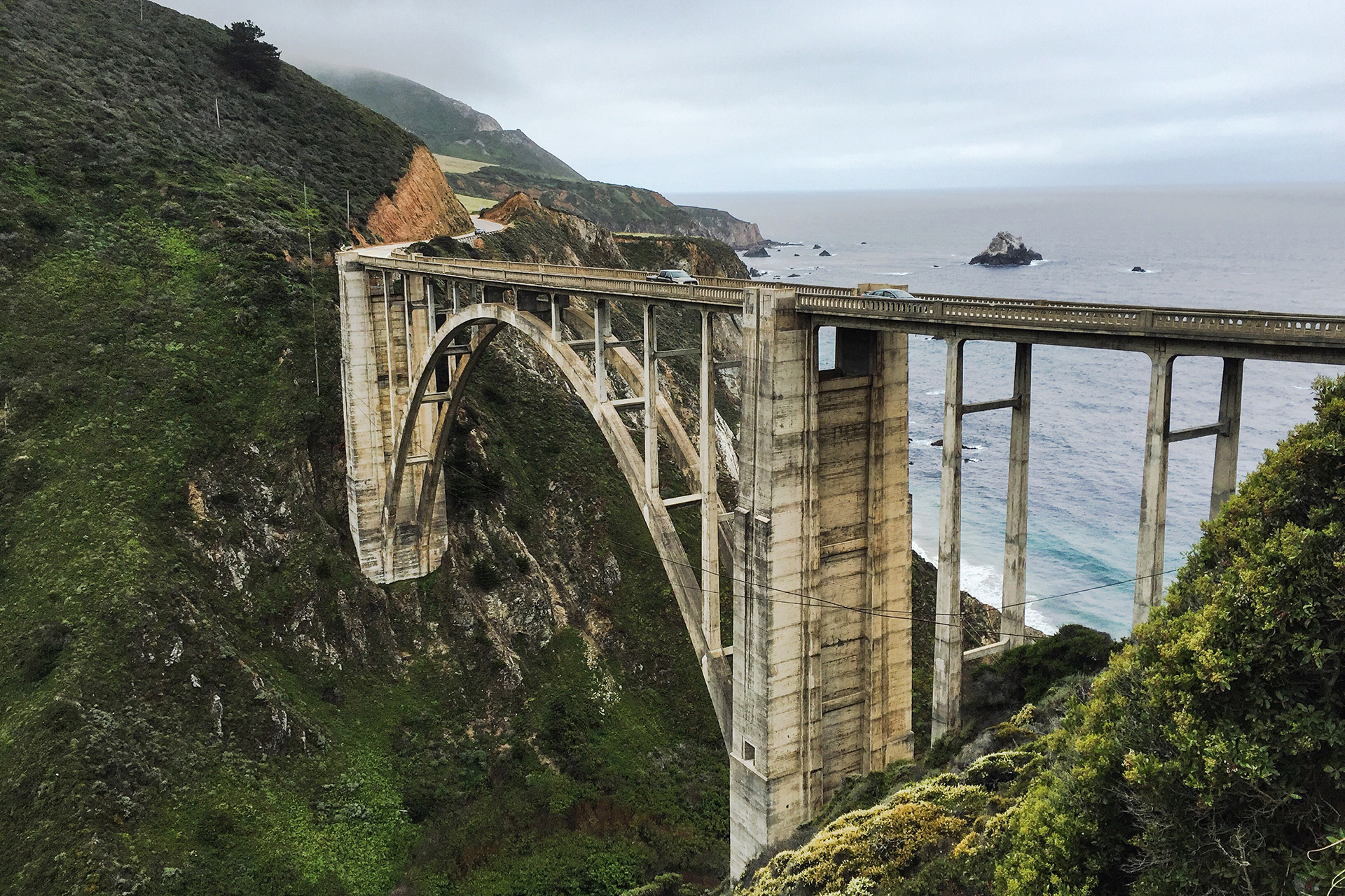 Bixby Creek Bridge spanning canyon with ocean in background