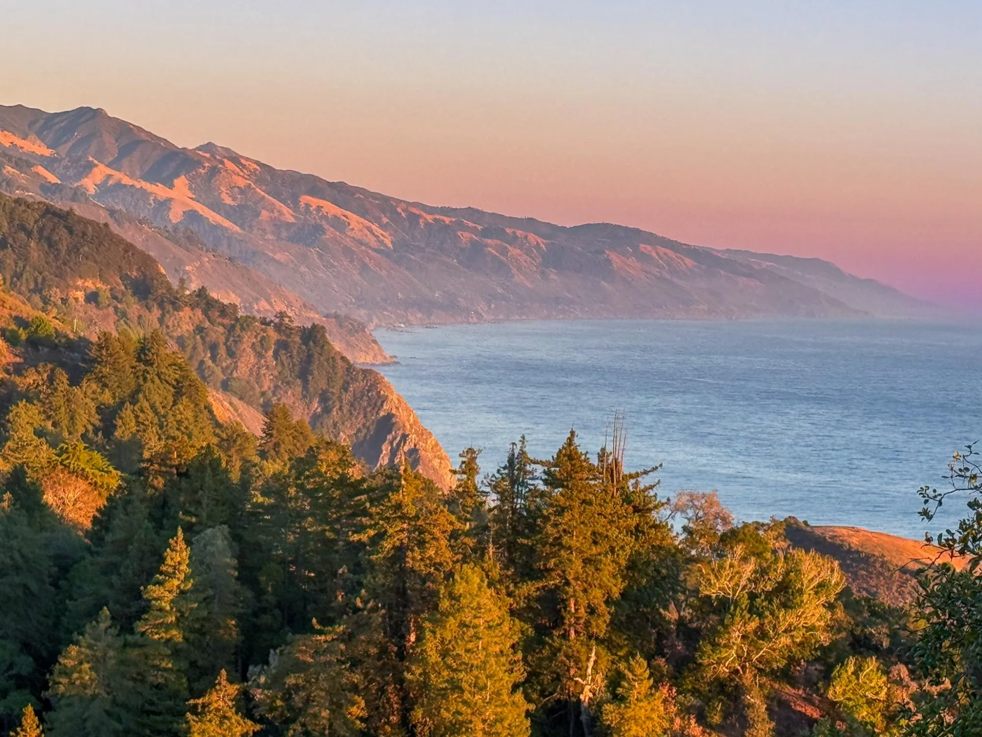 Big Sur sunset with redwoods and coastal mountains